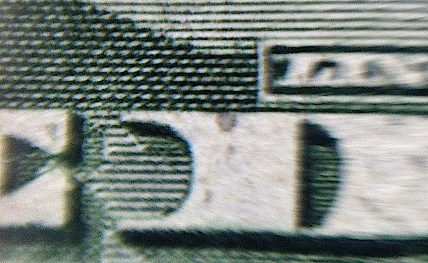Dollar zoom with water on iPhone lens