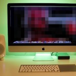 Vlogger iMac desk setup with LED color backlighting