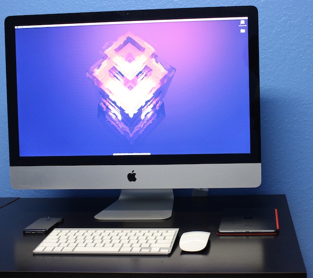 Student iMac desk setup with iPhone 5S and iPad Mini