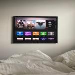 A wall mounted flat screen TV with Apple TV