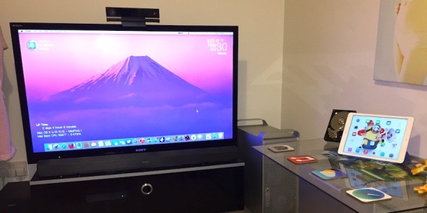 Mac Pro Man Cave setup with a jumbo screen TV and iPad