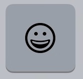 The Emoji button is a smiley face icon on the iOS keyboard