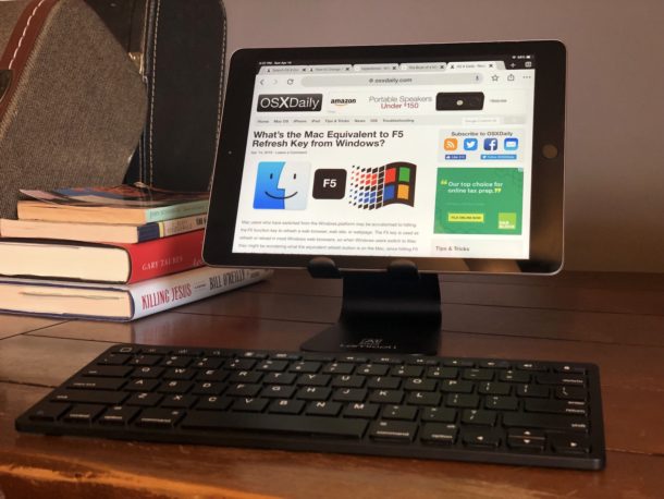iPad at desk on a stand with external keyboard